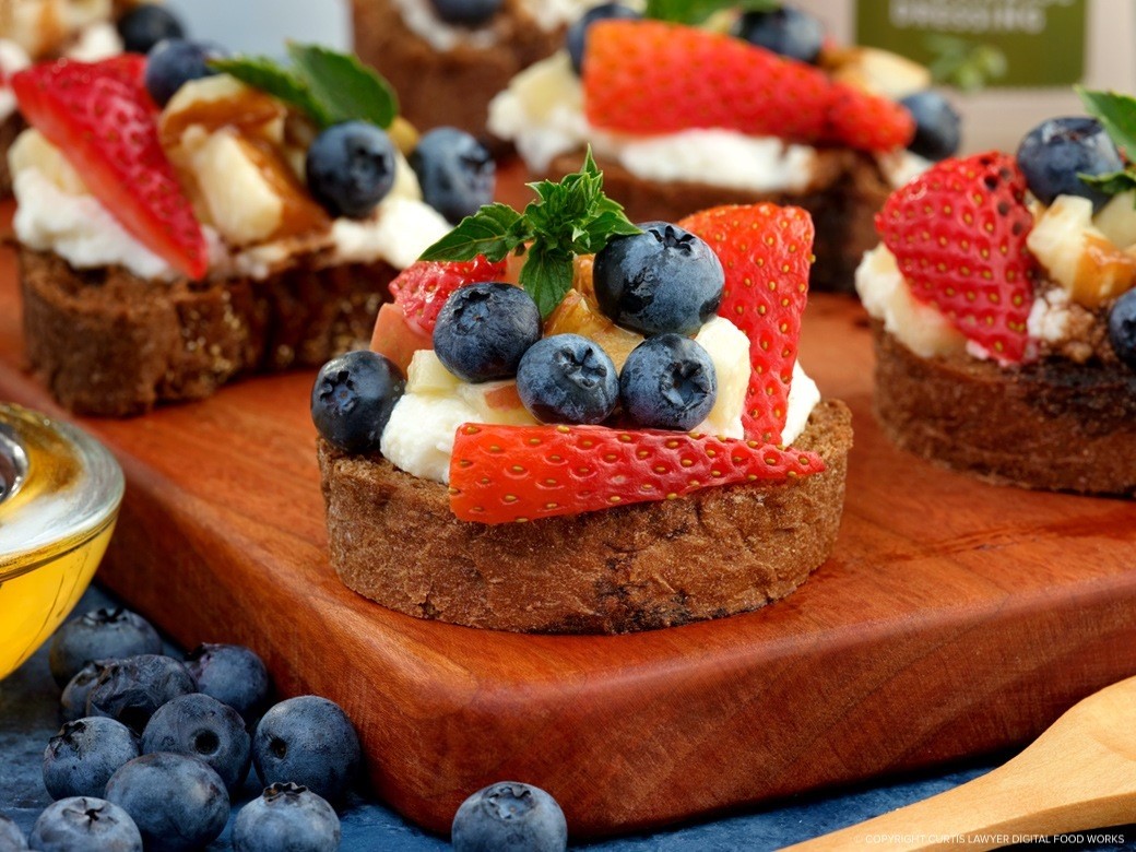 red, white, and blue fruit toast with lemon ricotta, diced apples, strawberries, and blueberries  featuring hellmann's products