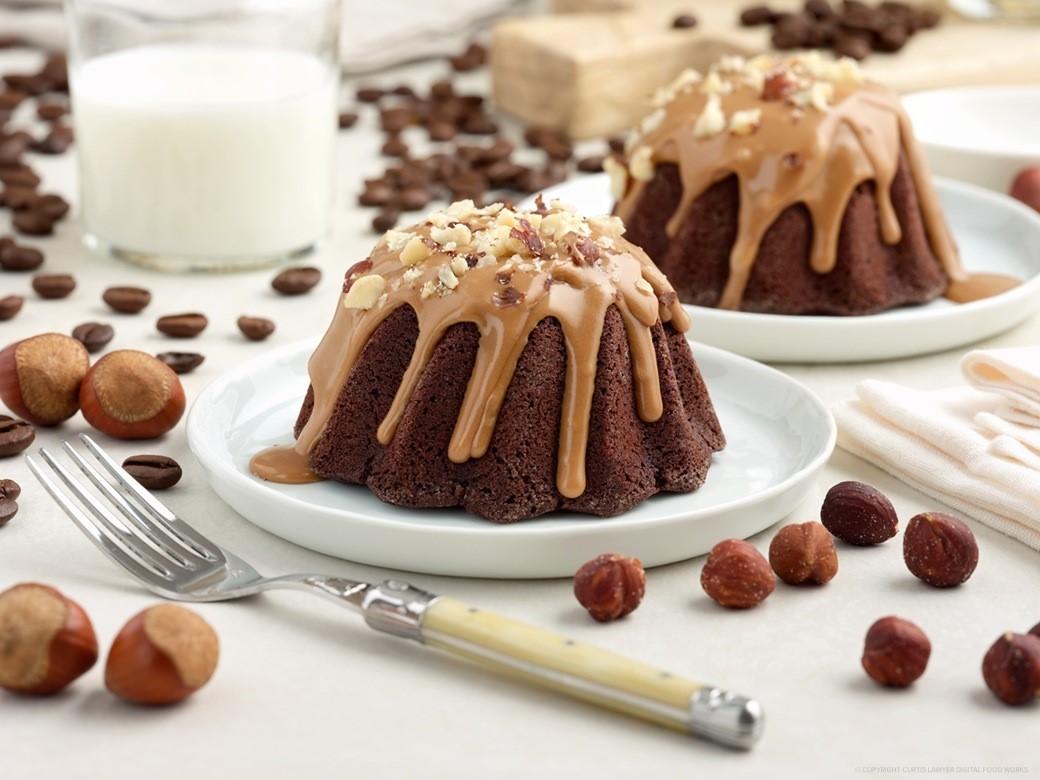 dutch chocolate mini bundt cake with mocha drizzle and roasted hazelnuts