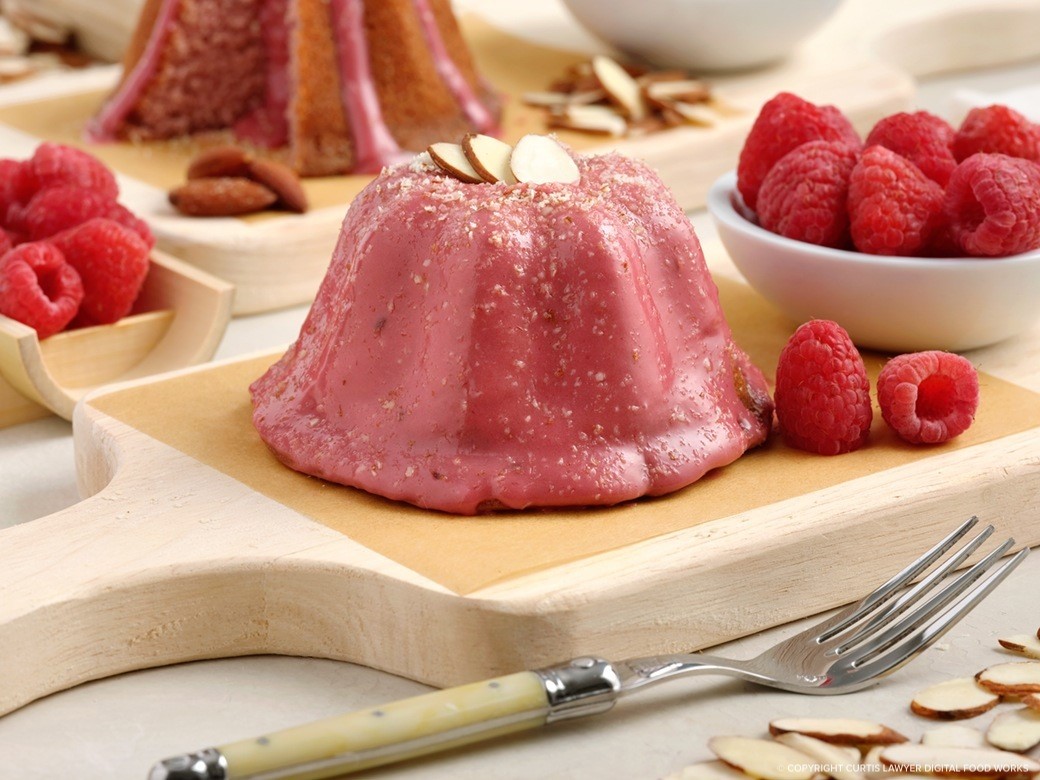 raspberry mini bundt cake with raspberry vanilla glaze and almonds featuring monin® products