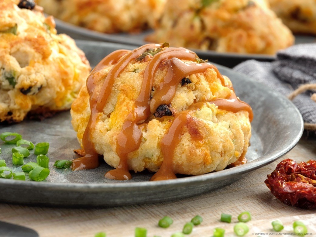 sun-dried tomato and cheddar scones with bourbon bbq drizzle featuring hellmann's products